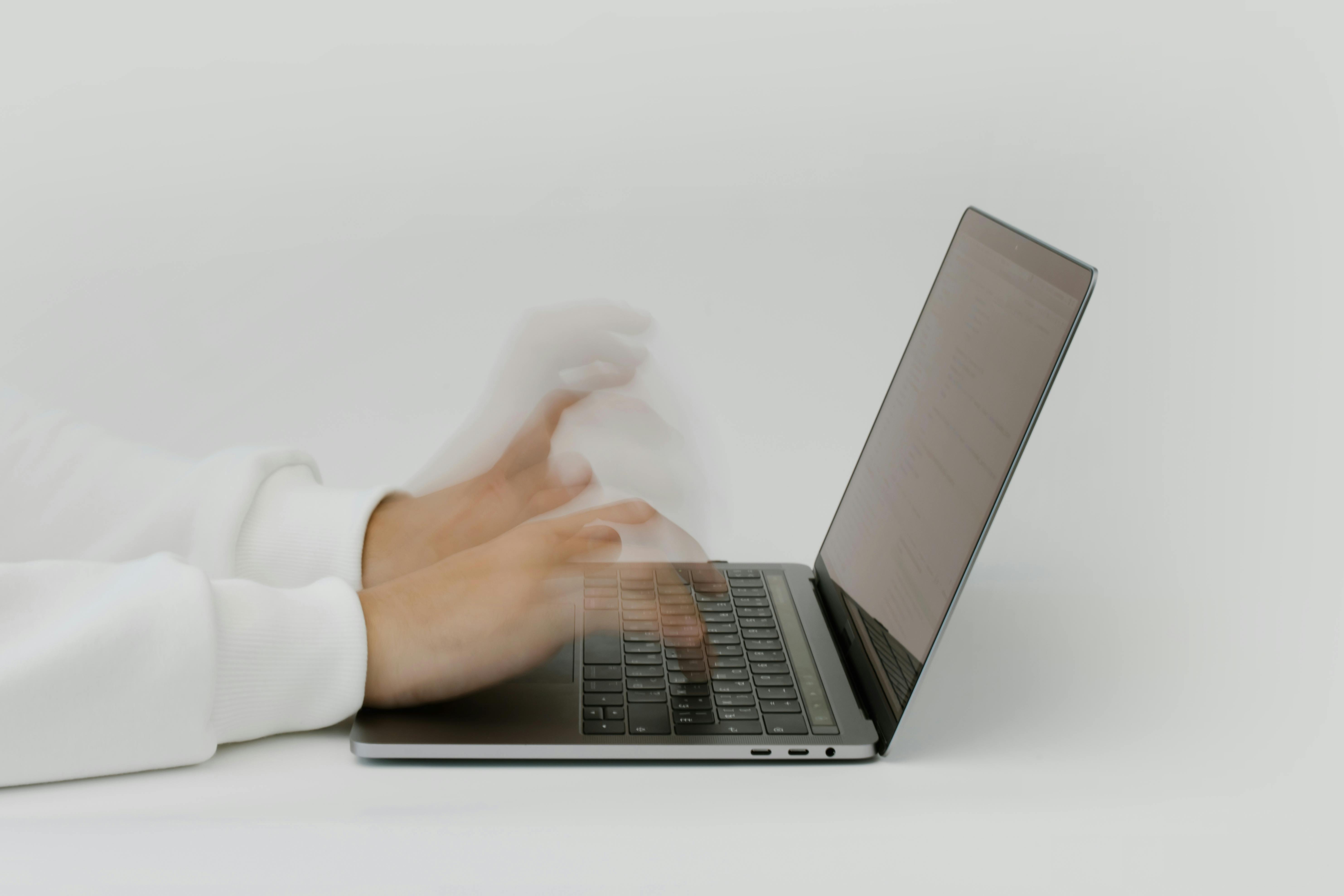 person rapidly typing on computer